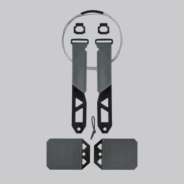 Tactical cutaway system with gray straps, black frame, and two rectangular attachment pads