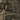 Close-up of MOLLE strap on olive backpack showing EPOS lettering