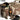 Desert camo rifle bag open with side pouches and padded interior compartments