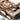 Camo rifle bag with padded shoulder strap, front buckles, and zippered compartments