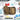 Open tan medical pouch with zipper compartments and bundled first-aid supplies