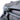 Gray backpack fabric and zipper pull with corded trim detail