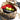 Tan camouflage mini hauler with open top, red interior and green balls
