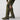 Camouflage field pants with thigh cargo pocket and belt loops over sturdy boots.