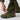 Camouflage field pants with adjustable ankle cuff and reinforced hem panel near boots.