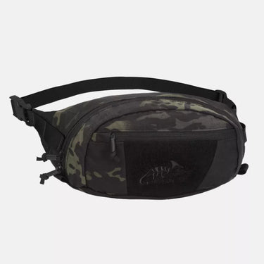 Waist pack in dark camo with central zip compartment and adjustable shoulder strap