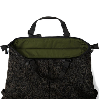 Black patterned tote bag with olive interior panel and zip-top opening