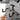 Gray wall-mounted pistol hanger with dual hooks and adjustable locking hardware