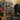 Black wall rack system peg hooks on a slotted wall display rail