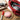 Leather-cased tape measure with pink round case and white measuring tape