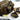 Tan tactical ammo carrier with interior compartments and small green loose sac pouch