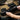 Hook-and-loop equipment straps, black, being tightened with hook-and-loop, stitched logo pads