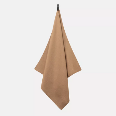 Coyote brown field towel, triangular folded fabric with metal clip at top.