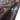 Sheepskin bomber jacket sleeve with blue-and-yellow embroidered logo patch