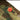 Combat tactical pants button detail with red Pentagon patch and stitched camo panels