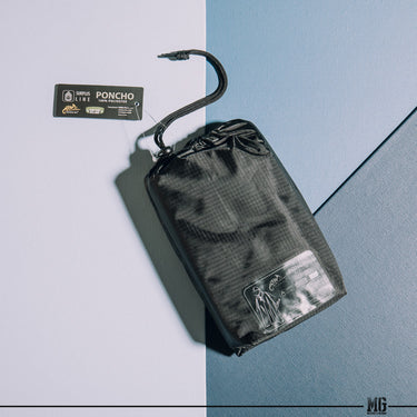 Camouflage poncho pouch with cord, front label and sealed sleeve