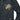 Black bomber jacket close-up with stand collar, zipper, and dragon embroidery