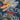 Navy bomber jacket embroidery close-up with winged dragon design and clouds