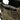 Plate carrier side pocket panel with tan webbing and black zipper closure