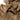 Tan balaclava fabric close-up with stitched paneling and face opening edge