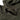 Green balaclava close-up showing textured fabric and stitched face opening