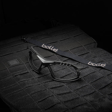 Black protective sport glasses with Bolle logo and side strap