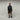 Black hooded smock jacket on model with front zip and relaxed fit