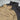 Black and olive drab smock jackets close-up of front zippers and collar