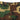 Woodland camouflage cargo pants front with belt loops and buttoned pocket.
