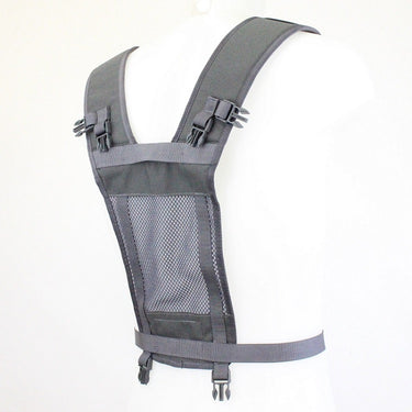 Grey tactical yoke system with padded shoulder straps and mesh front panel