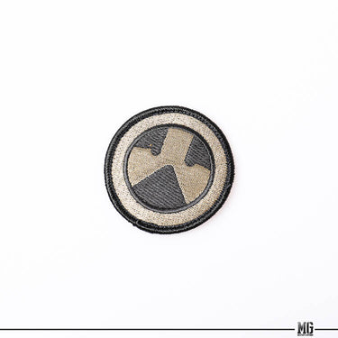Magpul logo patch, black-and-tan circular embroidered emblem with stitched border
