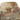 Camouflage tactical hat with central logo badge on front panel