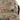 Camouflage shorts fabric close-up with stitched label on waistband