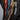 Color-block rain shell jackets showing multiple front zippers in black trim