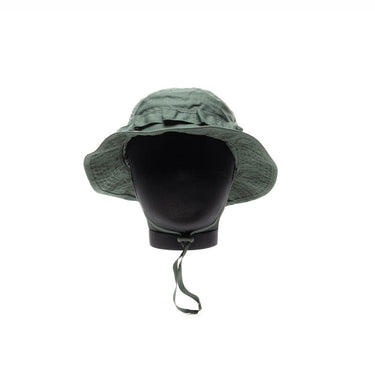 Green jungle hat with wide brim and chin strap, front flap.
