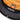 Black bucket hat front band with “MILES” patch and orange inner lining