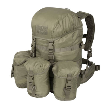 Tan 35L tactical backpack with front flap, side pouches, and padded shoulder straps.