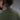Olive green henley shirt back close-up with short collar and small neck logo