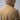Tan rain shell jacket with back seam detail and small chest logo