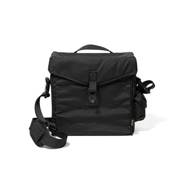 Black military camera bag with flap top, front buckle, and adjustable shoulder strap