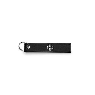 Sturm EK embroidered key ring: black strap with white cross emblem and metal ring