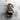 Sturm navy teddy bear plush back view wearing sailor cap and striped apron-style bib