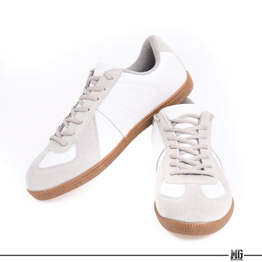 White low-top sport sneakers with lace-up front and gum rubber sole