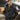 Navy wool peacoat on model with raised collar and double-breasted buttons