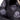 Close-up of black leather jacket sleeve and chest patches with insignia graphics