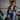 Brown leather flight jacket with fur collar and colorful patches