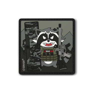 Square tactical patch with cartoon raccoon face and red teeth