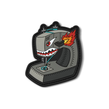 Angry sewing machine embroidered patch, black outline with gray machine and red flame