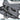 Grey rifle case laid open with padded interior compartments and securing webbing straps