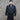 Black CWU 45P jacket worn by a man, front zipper and flap chest pocket detail